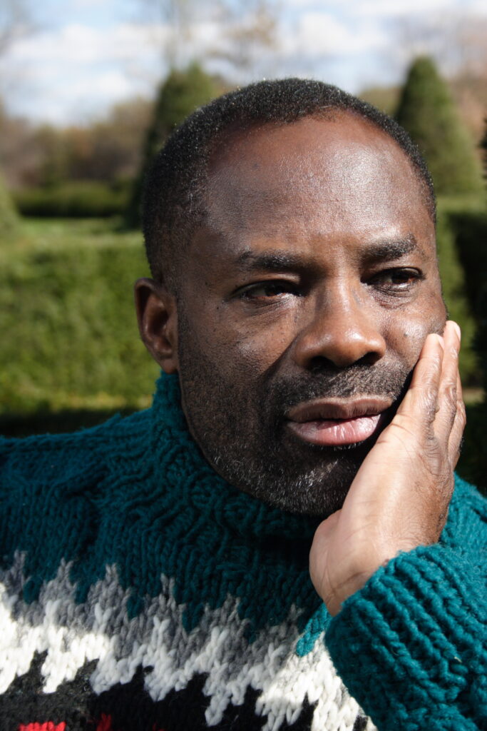 Philip Emeagwali in a green sweater