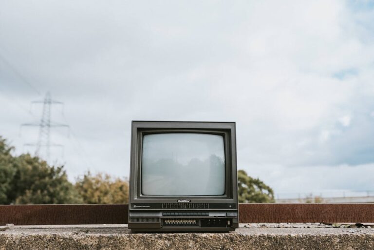 Classic CRT television placed outdoors, conveying a nostalgic and abandoned vibe.